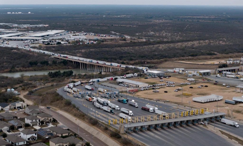 Trucks at the international border crossing along the corridor