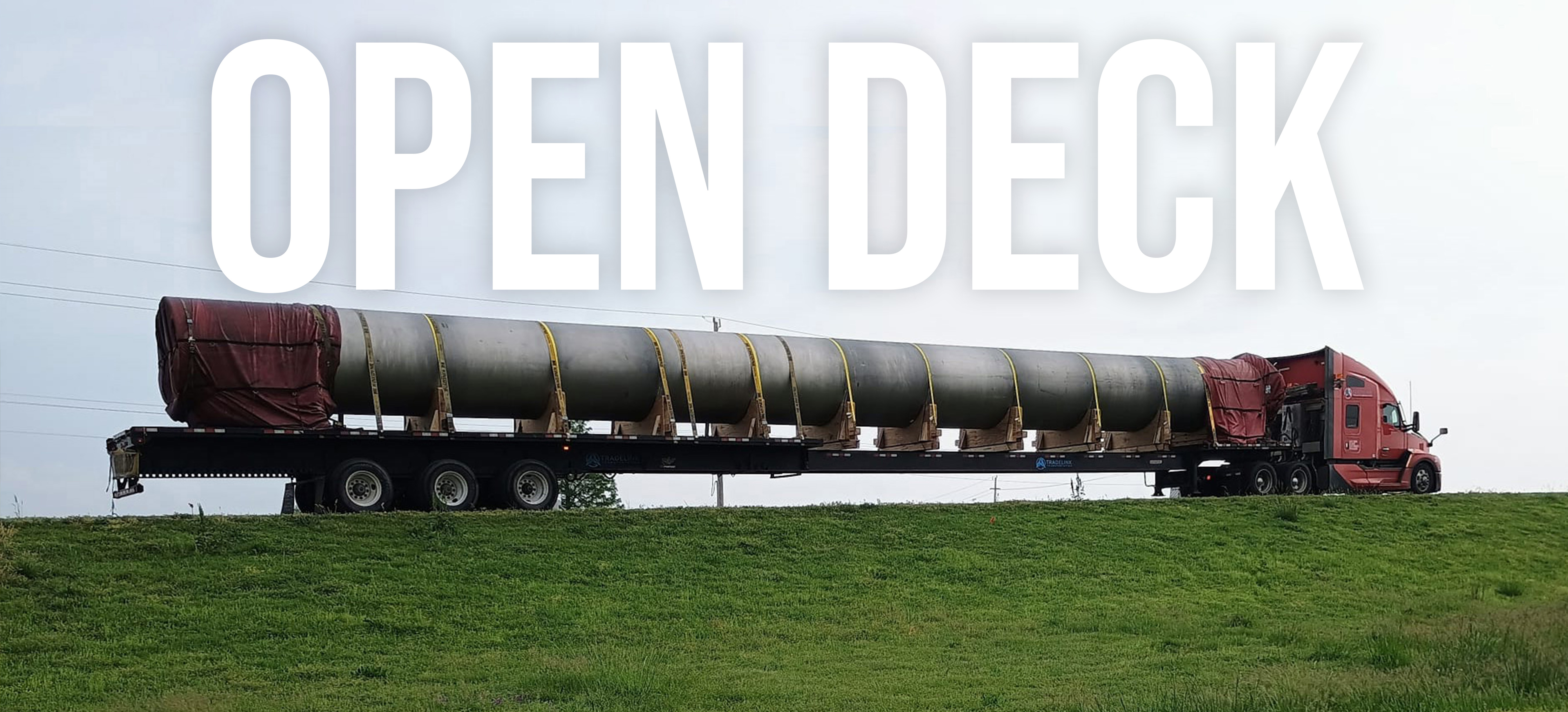Open Deck & OS/OW — flatbed carrying an oversized load