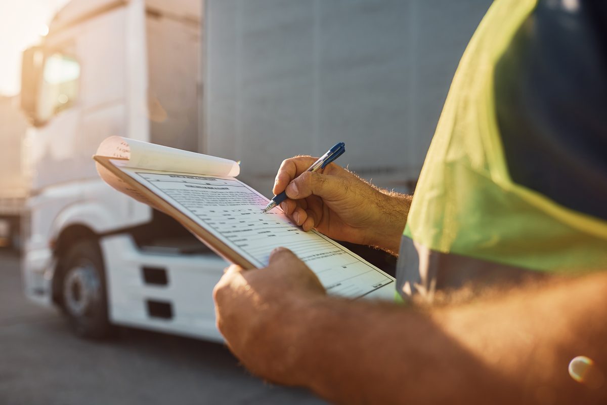 Dispatcher reviewing customs paperwork at the border